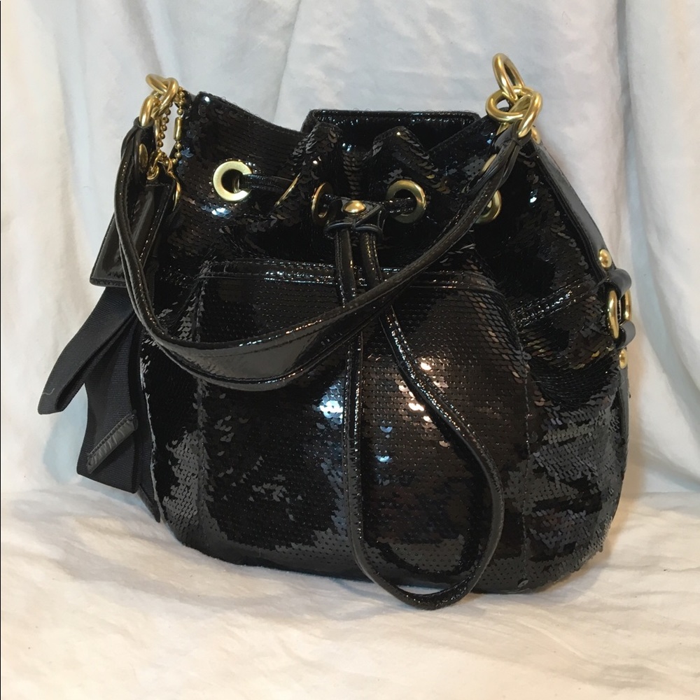 Black sequin drawstring Coach handbag.